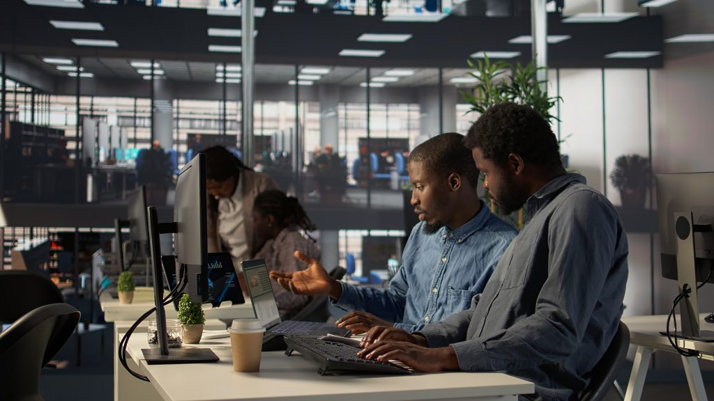 Black corporate team collaborate on global investment strategy - HR Data Labs LLC